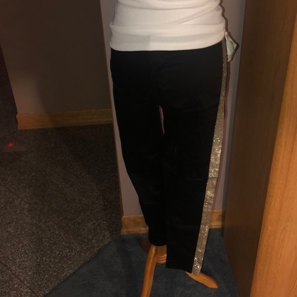 Made Fashion Week dress pants with gold detail.